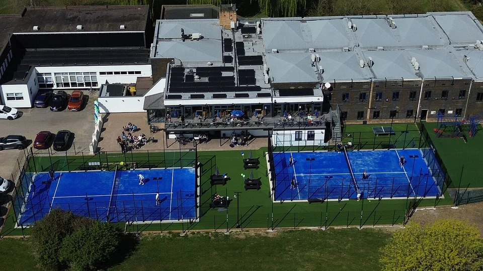 Aerial view of the blue padel courts at Club Kingswood